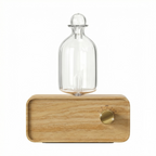Wooden lamp with a clear glass shade on a white background